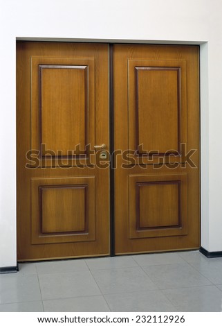Image of closed wooden security door
