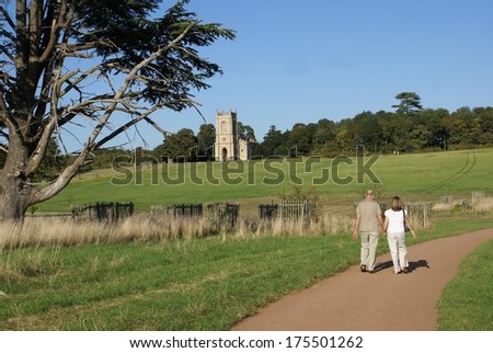 couple walking toward a church, countryside, England