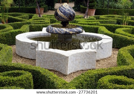 Mosaic unique fountain in garden. Garden design
