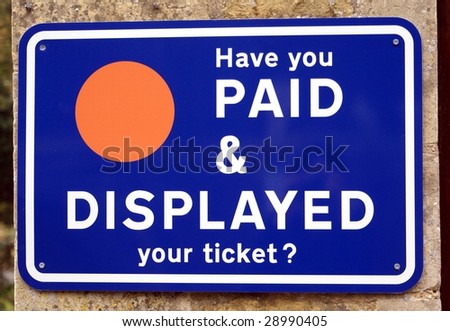 Car park sign. Have you paid & displayed your ticket? Money concept