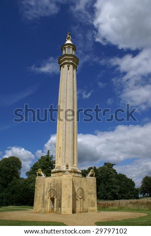 High column with statues of man & lions. Attraction in England