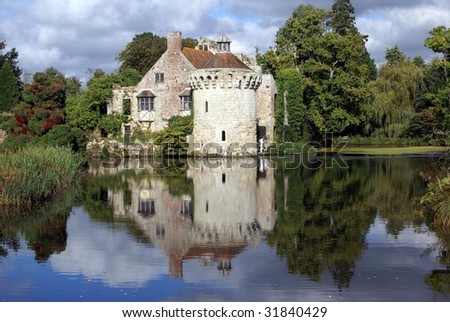 Historical castle surrounded by moat. Attraction in England