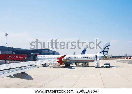 LARNACA, CYPRUS - 11 AUGUST, 2014 : Airbus A321 SX-DVP of Aegean Airlines parked at Larnaca International Airport. A commercial aircraft being serviced.