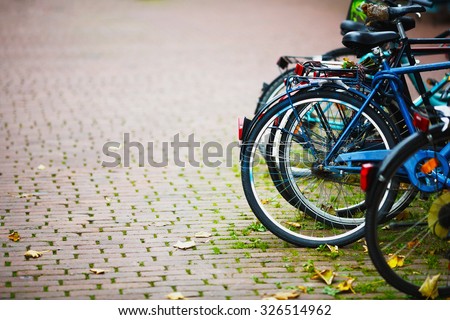 Parked Bicycles On Sidewalk. Bike Bicycle Parking On The Street