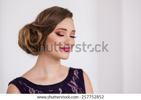 Portrait of beautiful girl with make-up . glamor portrait with flower, bright lips , smile