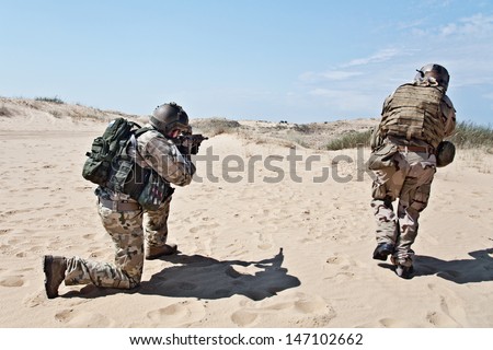 Two soldiers in the desert during the military operation