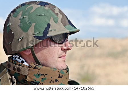soldier in the military helmet half-turned to the camera