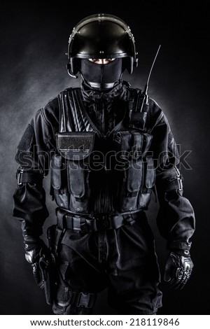 Spec ops soldier in uniform on black background