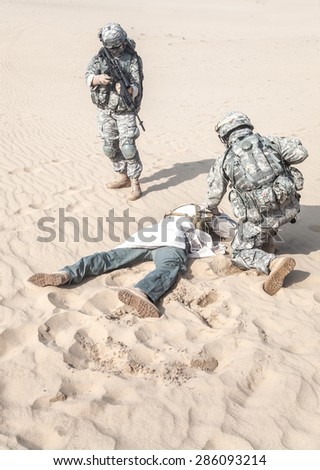 United States paratroopers airborne infantrymen capturing the muslim warrior forcing him to lie down