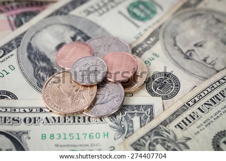 American Money, Small Pile of Cents Change on Dollar Notes