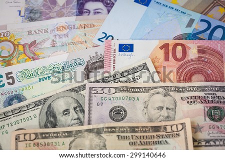 Rows of Mixed Currency Notes, Euros, British Pounds and American Dollars