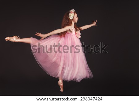 Portrait of an adorable teenager girl playing dress up wearing a ballet tutu
