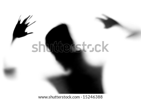 Shadow of person standing in front of a white screen