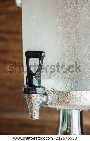 Drink a glass of cold water faucet drip attached.
