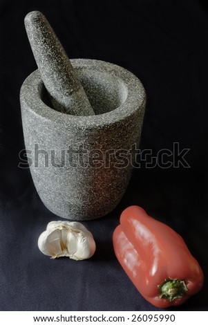Mortar and pestle with garlic and red pepper