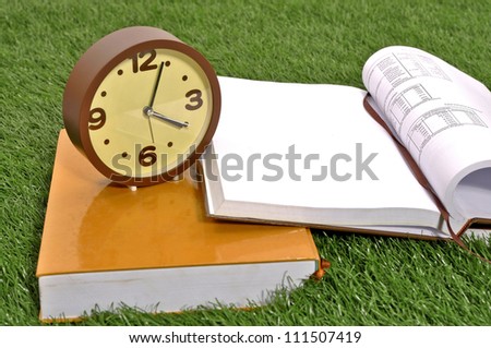 Learn college study on the green grass outdoor