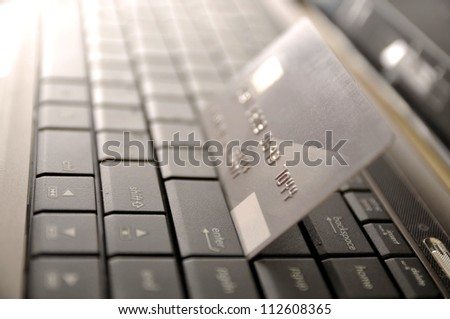 e-commerce concept. credit card and laptop with shallow DOF