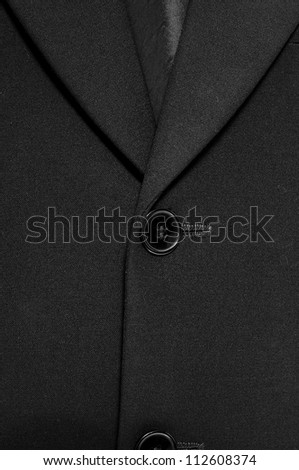 Close up of a button business suit coat