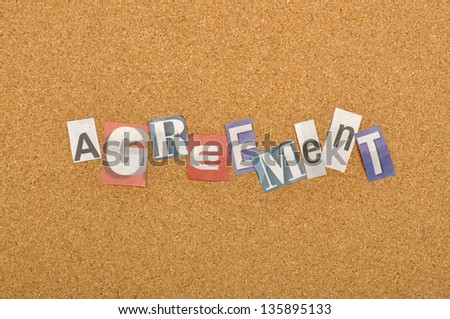 Agreement word made from newspaper letter shot over pinboard background