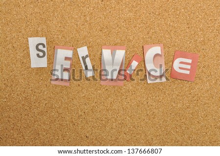 Service word made from newspaper letter shot over pinboard background