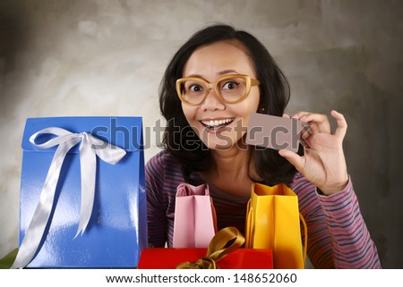 Shopping woman show blank credit card. You can put your own credit card design