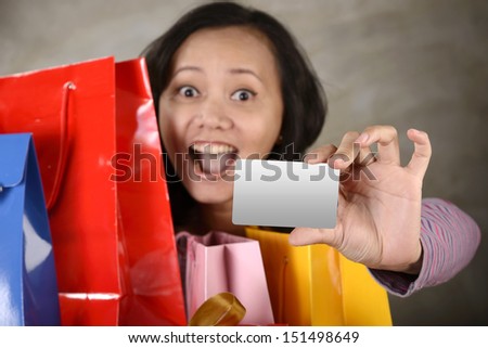 Shopping woman show blank credit card. You can put your own credit card design