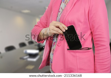 Woman hold smartphone in formal suit. You can put your design on the phone