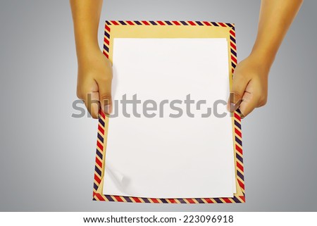 Human hand holding brown envelope. You can put your design here