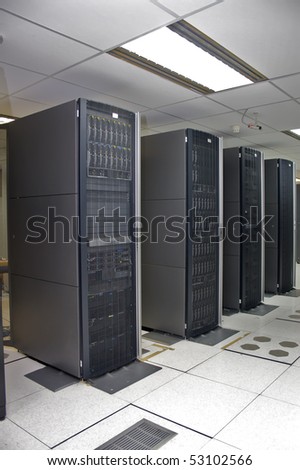 A clean and consistent row of server racks in a datacenter.