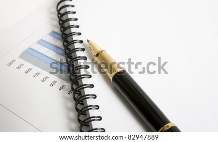 Blank agenda and a pen. Someone want to analyze business report