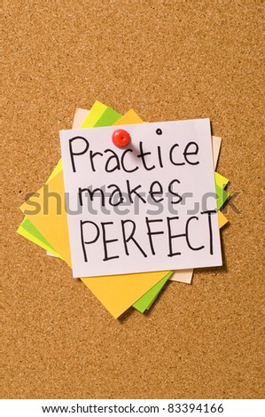 Practice Makes Perfect write on the paper on the cork board
