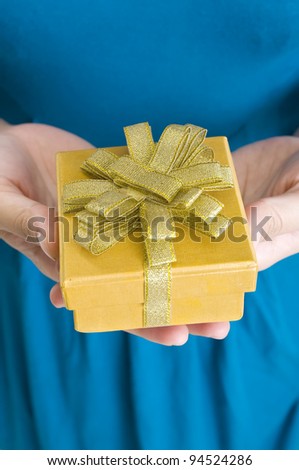 Woman in blue dress give present or gift to someone