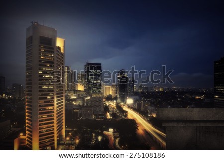 Background of jakarta city night scape with wall. You can put your object on the wall