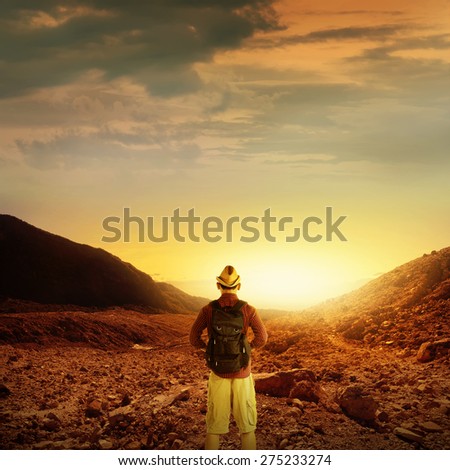Young traveler male from back view trekking on the papandayan mountain in Indonesia at summer time