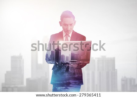 Business man with multiple exposure holding tablet computer. Business technology concept