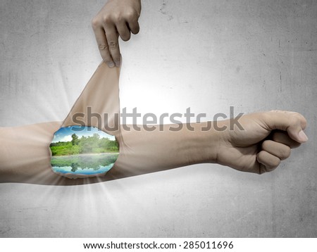 Man remove his arm skin to show travel place. Wanting to travel concept