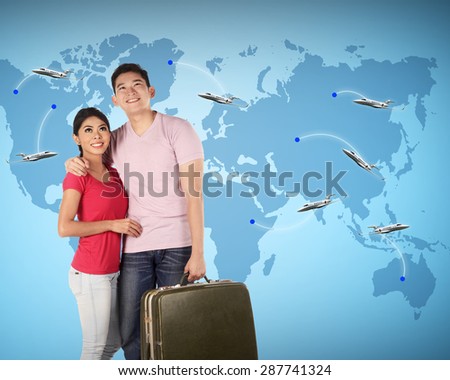 Couple travel around the world with earth map on the background