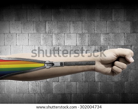 Man hand with zipper open LGBT Flag inside