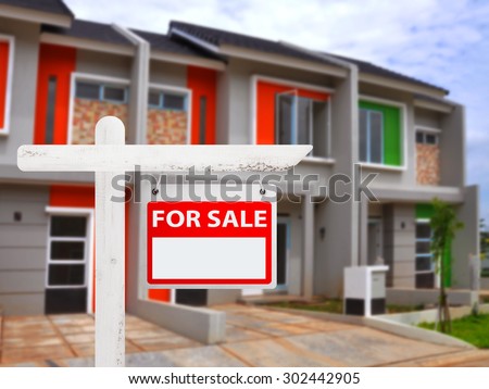 House for sale board with house background. You can put your number on the board