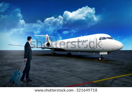 Asian business person walking to airplane carry suitcase. Business travel concept
