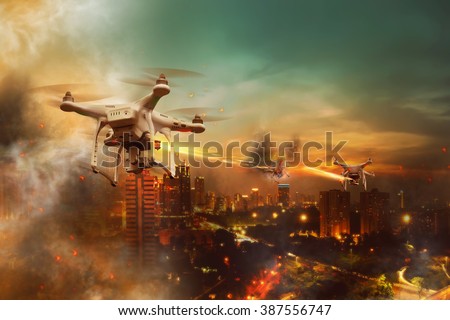 Drones battle over the city at night time