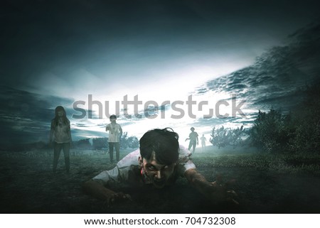 Crowd of creepy asian zombies with angry face walking around on the spooky countryside