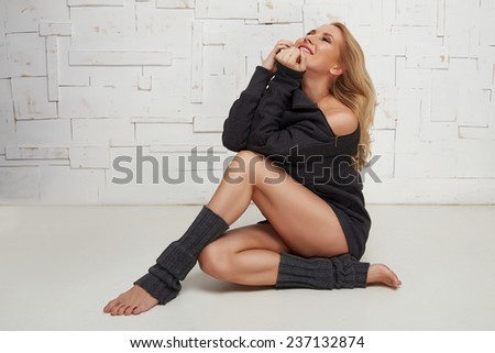 Beautiful sexy blonde with perfect athletic slim figure engaged in yoga, pilates, exercise or fitness, lead healthy lifestyle, and eats right relaxes meditation