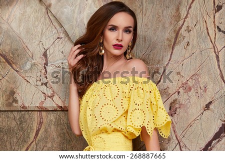 Beautiful stylish young fashion girl with perfect evening make-up with pink lips and green eyes in elegant clothes hills, skirt, top and jacket dress catalogue summer collection