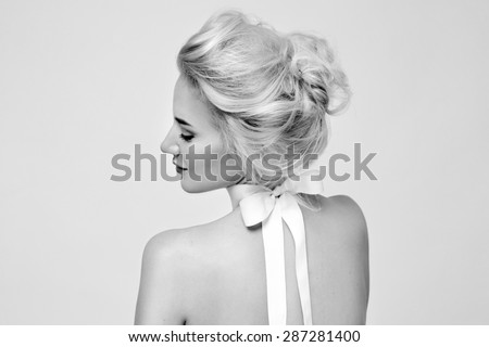 Tender fashion portrait of beautiful gentle young blond woman with silk bow on the neck cosmetics for body face hair pure natural beauty, organic and diet harmony, makeup