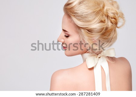 Tender fashion portrait of beautiful gentle young blond woman with silk bow on the neck cosmetics for body face hair pure natural beauty, organic and diet harmony, makeup
