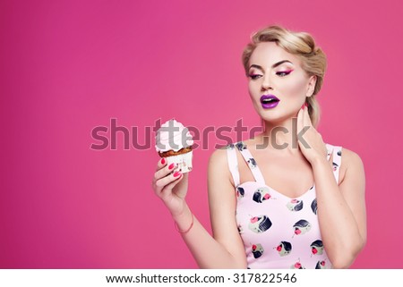Portrait of young beautiful perfect sexy woman with blond hair, fashionable styling evening make-up organic cosmetics, facial features in a beauty salon eat sweet cupcake cake diet and manicure