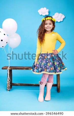 Small little beautiful pretty cute girl dark hair hat with flowers wear fashion style trend clothing dress skirt blouse shoe smile play with bench and balloons dance\
jump children kid happy daughter