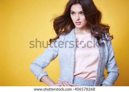 Business woman in office clothes wear costume flax jacket and skirt light blue silk pink hold hand lather bag goods accessory fashion style collection glamour pose model natural beauty makeup perfect