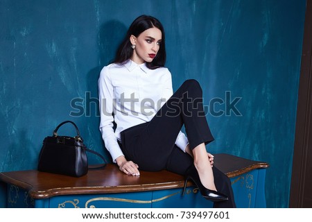 Sexy beautiful woman dark brunette hair wear clothes pants jacket trend accessory makeup perfect body model fashion office style businesswoman natural beauty casual silk texture elegant design formal.